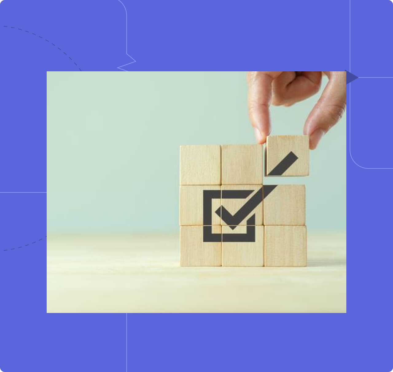 A hand places a wooden block with a checkmark inside a square, symbolizing compliance or successful completion.
